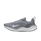 Gray Nike React X running shoe with white swoosh, breathable knit upper, and cushioned sole for women's fashion fitness