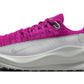 Vibrant pink women's running shoe with white sole, breathable knit upper, and Nike swoosh for athletic performance
