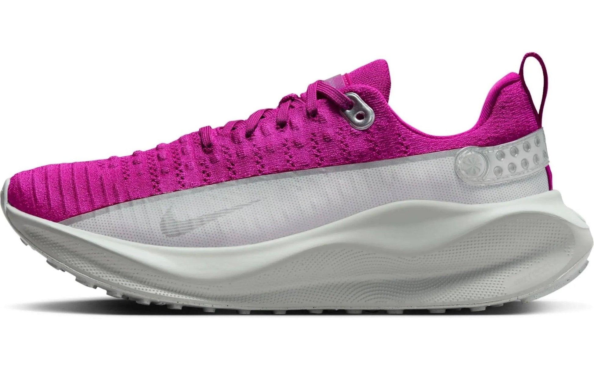 Vibrant pink women's running shoe with white sole, breathable knit upper, and Nike swoosh design
