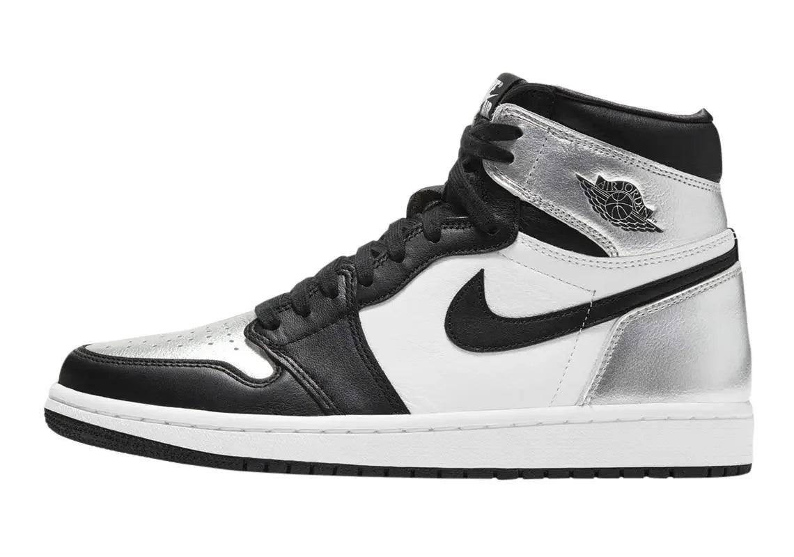 Black and silver Air Jordan 1 high-top sneaker with Nike swoosh, perfect for fashion and streetwear styles