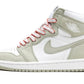 White and sage green Air Jordan 1 high-top sneaker with pink laces, perfect for women's fashion and streetwear style.