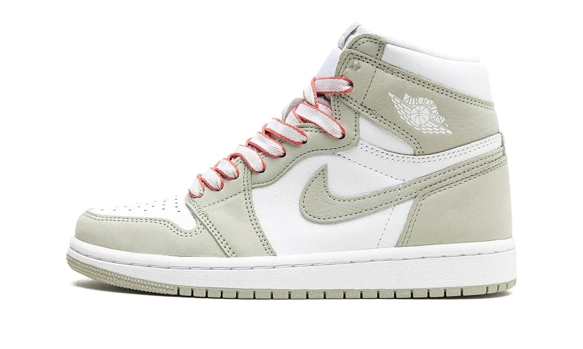 White and sage green Air Jordan 1 high-top sneaker with pink laces, perfect for women's fashion and streetwear style.