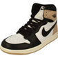 Black and white high-top sneaker with tan accents, Nike swoosh, and Air Jordan logo for women's fashion