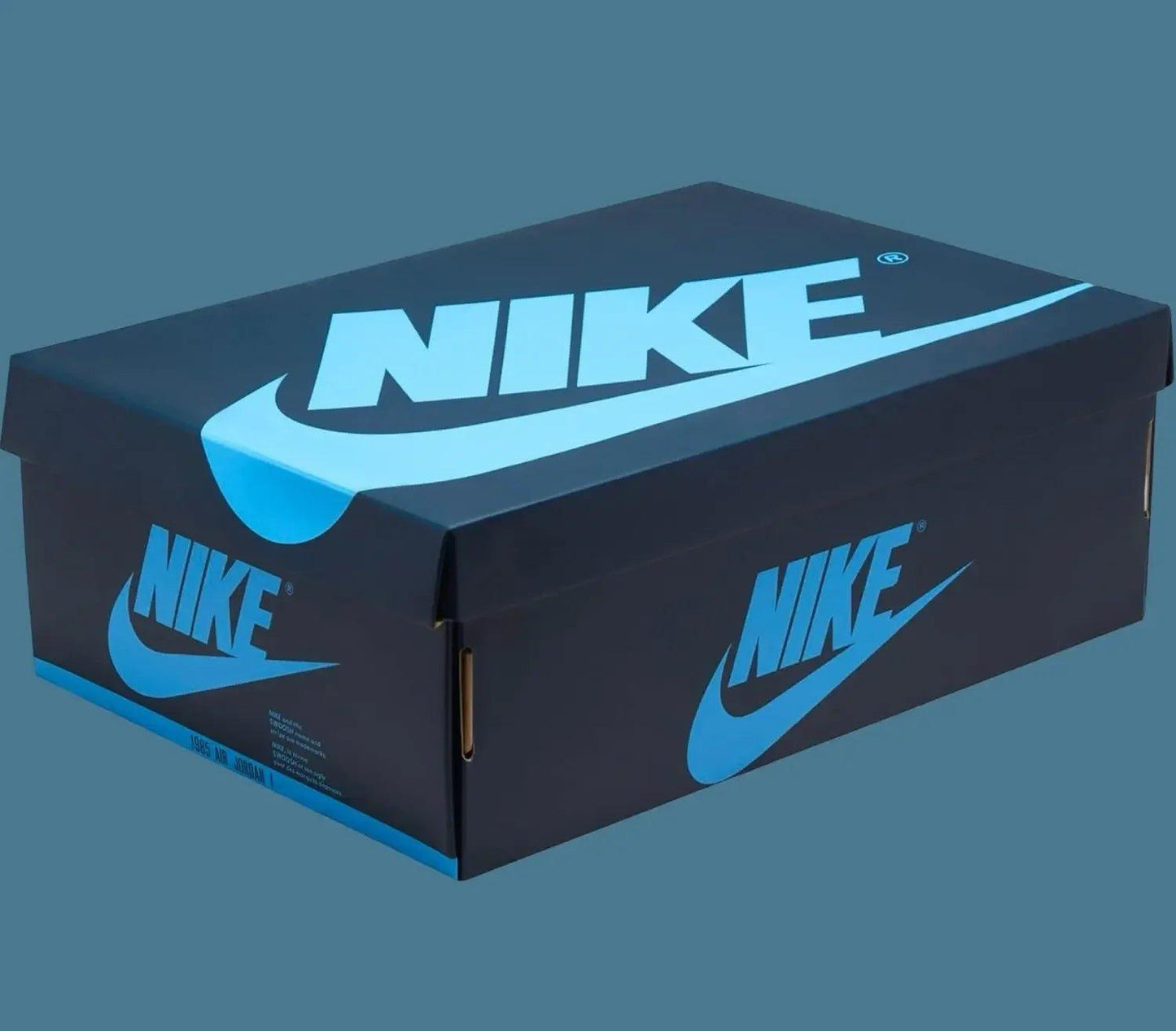 Nike Air Jordan 1985 shoe box with bold blue logo on black packaging