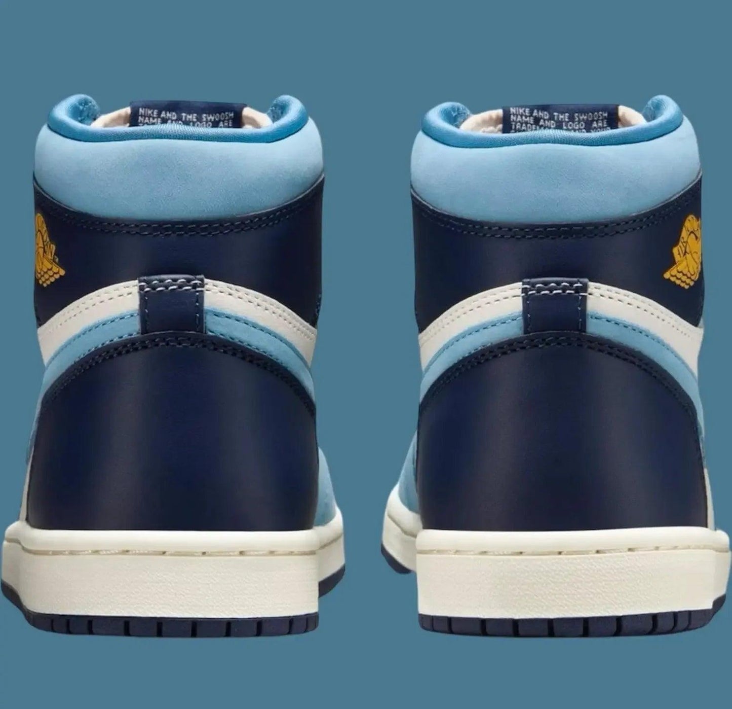 Blue and navy high-top sneakers with gold logo, white sole, and suede accents for women's fashion