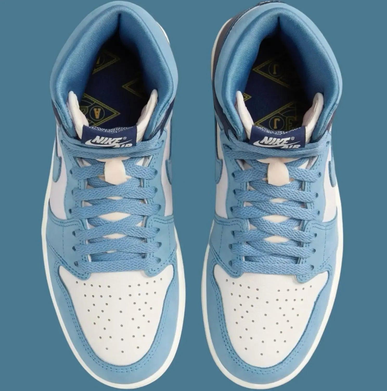 Light blue and white Nike Air Jordan 1 high-top sneakers with perforated toe box and branded tongue