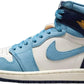 Air Jordan 1 High sneaker in light blue, white, and navy with gold logo, women's fashion footwear
