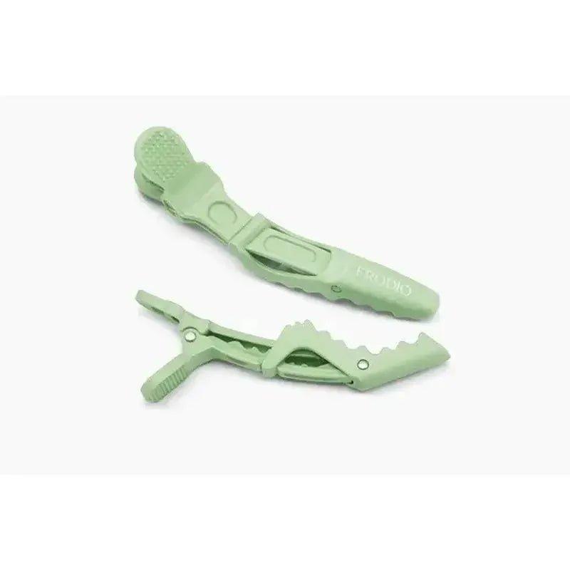 Mint green hair clips with textured grip, ideal for women's fashion styling