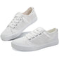 White canvas sneakers for women, casual fashion footwear with lace-up design and clean white soles
