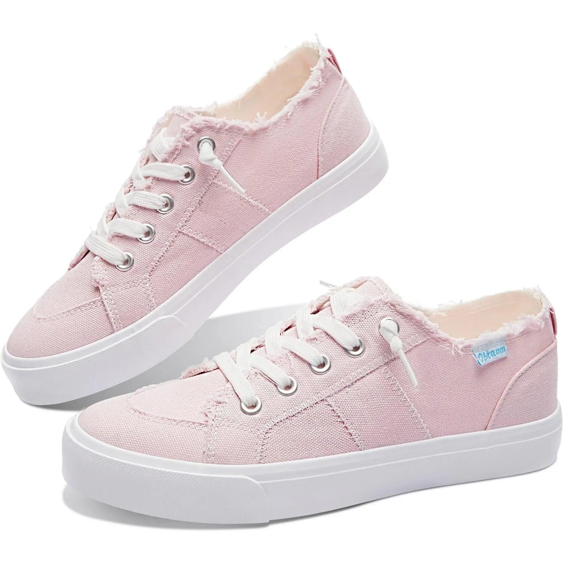 Pink canvas women's sneakers with white laces and distressed edges, casual fashion footwear