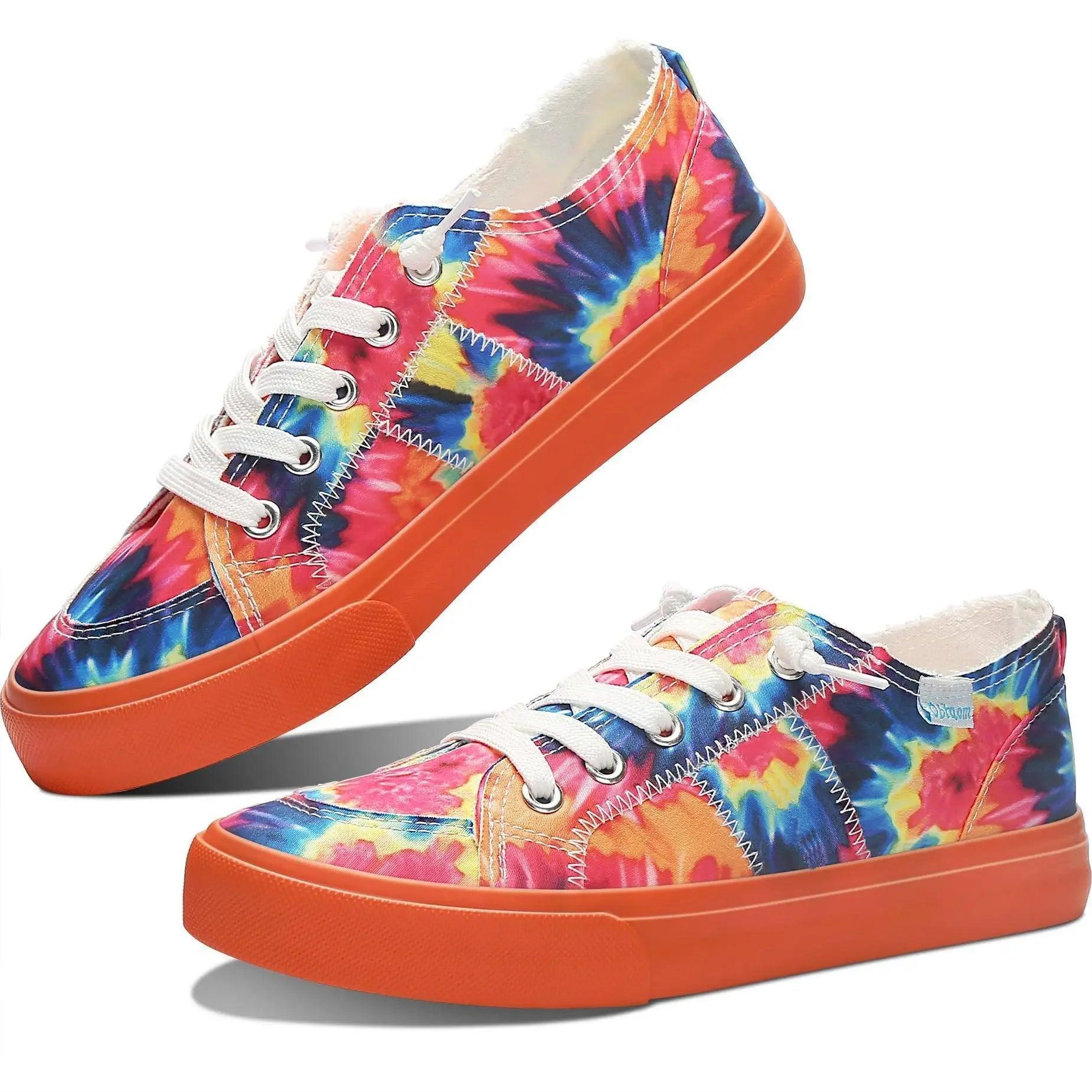 Vibrant tie-dye women's canvas sneakers with orange soles, perfect for casual fashion