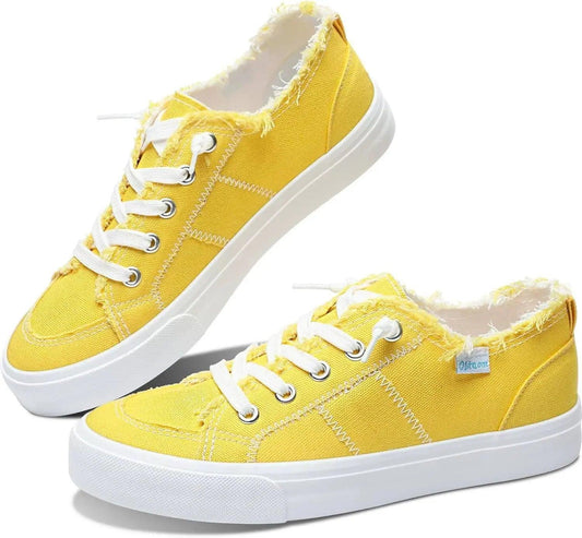 Bright yellow women's canvas sneakers with white laces and frayed edges, casual fashion footwear