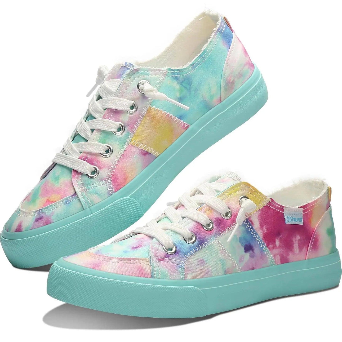 Pastel tie-dye women's canvas sneakers with mint sole, white laces, and rainbow stripe detail