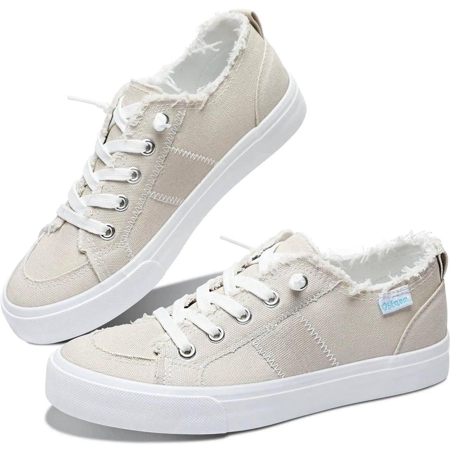 Beige canvas women's sneakers with white laces and frayed edges, stylish casual footwear for everyday wear