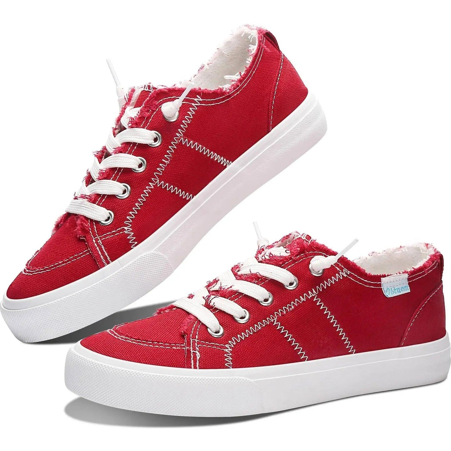 Red canvas sneakers with white laces and zigzag stitching, stylish women's fashion footwear