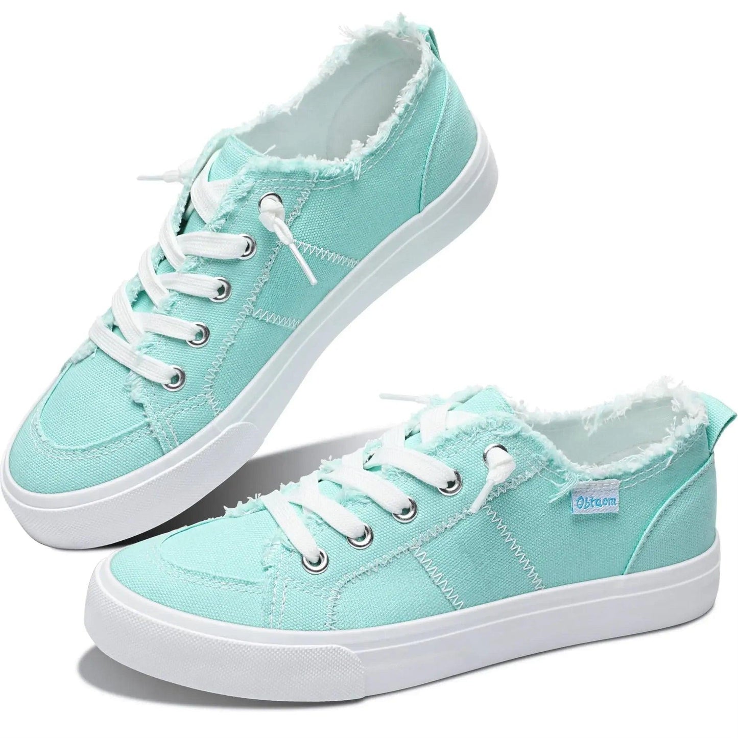 Mint green women's canvas sneakers with white laces and frayed edges, casual fashion footwear