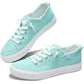 Mint green women's canvas sneakers with white laces and frayed edges, casual fashion footwear