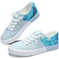 Light blue tie-dye canvas sneakers with white laces and distressed edges, women's fashion footwear