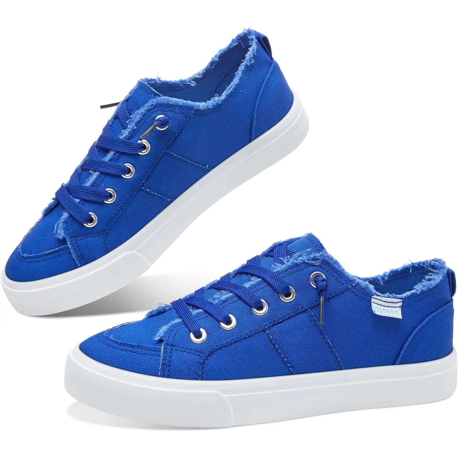 Vibrant blue canvas sneakers with white soles, frayed edges, and silver eyelets for women’s casual fashion