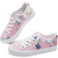 Pink floral women's sneakers with white laces and frayed edges
