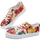 Women's colorful floral canvas sneakers with white laces and distressed edges, perfect for casual fashion