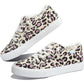 Pink and black leopard print women's canvas sneakers with white laces and frayed edges