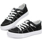 Black women's canvas sneakers with white laces and distressed detailing, casual fashion footwear