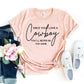 Pink graphic tee with 'Once You Love a Cowboy' text, paired with jeans, white sneakers, and pink flowers