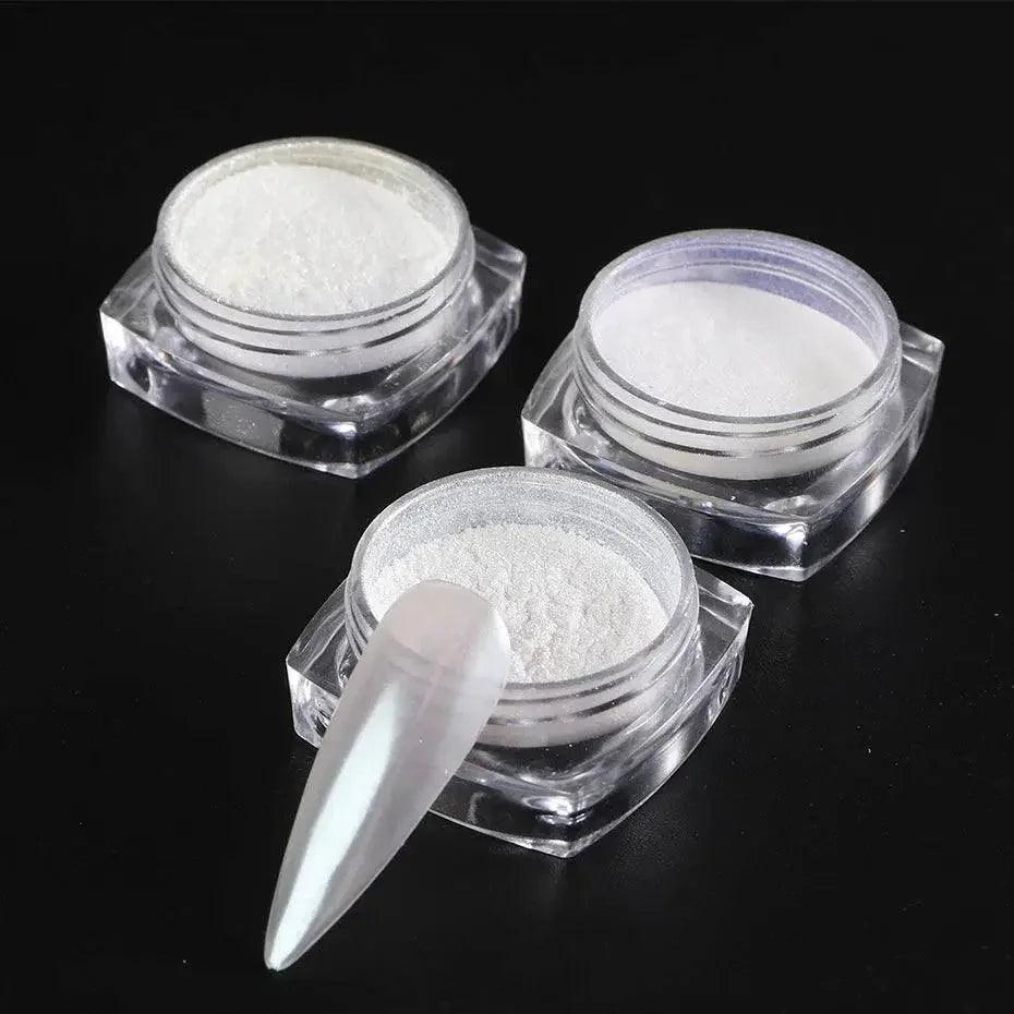 White nail powder in clear jars with acrylic nail tip, beauty and fashion essentials
