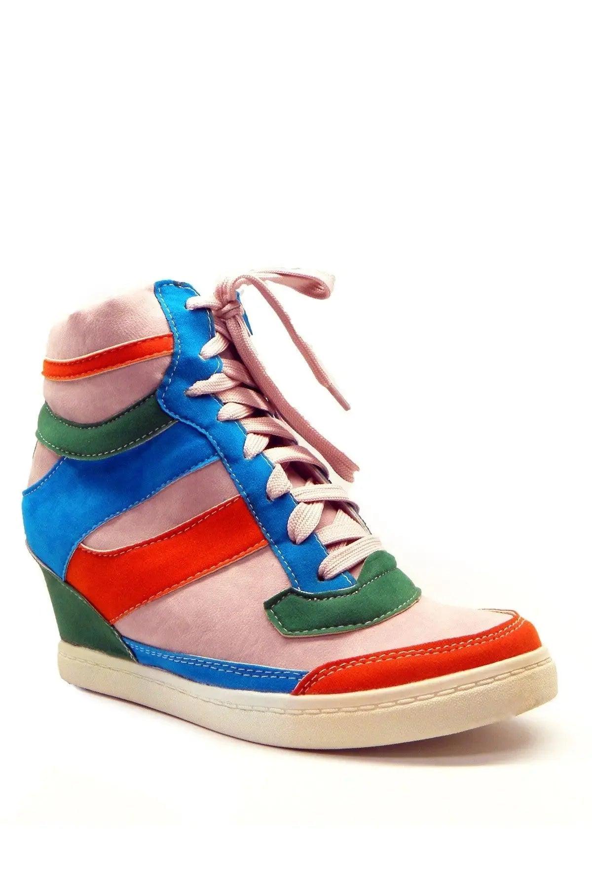 Colorful women's wedge sneaker with blue, pink, orange, and green panels, perfect for fashion-forward styles.