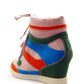 Colorful women's wedge sneaker with pink, blue, green, and orange panels, lace-up design, and platform sole