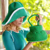 Woman in green knit hat and matching crocheted handbag, stylish summer fashion accessory set