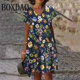 Woman wearing navy floral print V-neck dress, summer fashion, casual style