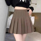 Brown pleated mini skirt with black crop top, women's fashion outfit