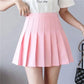 Pink pleated mini skirt for women, stylish summer fashion with white top and black handbag