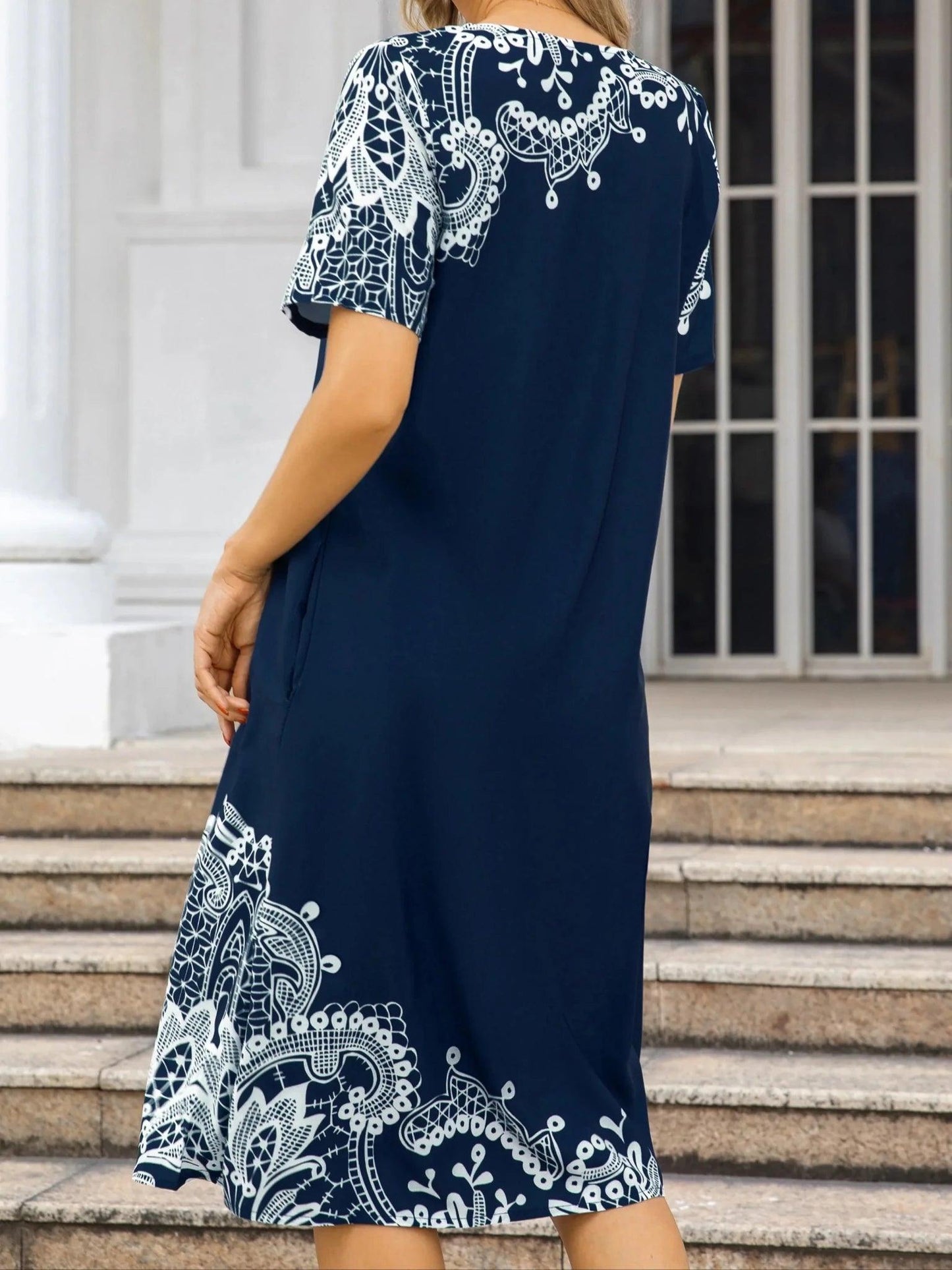 Navy blue women's dress with white lace print, short sleeves, knee-length, casual fashion style