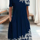 Navy blue women's dress with white lace embroidery, short sleeves, and pockets, perfect for casual fashion.