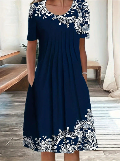 Navy blue women's dress with white lace embroidery, short sleeves, and pockets, perfect for casual fashion.