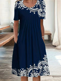 Navy blue women's dress with white lace embroidery, short sleeves, and pockets, perfect for casual fashion.