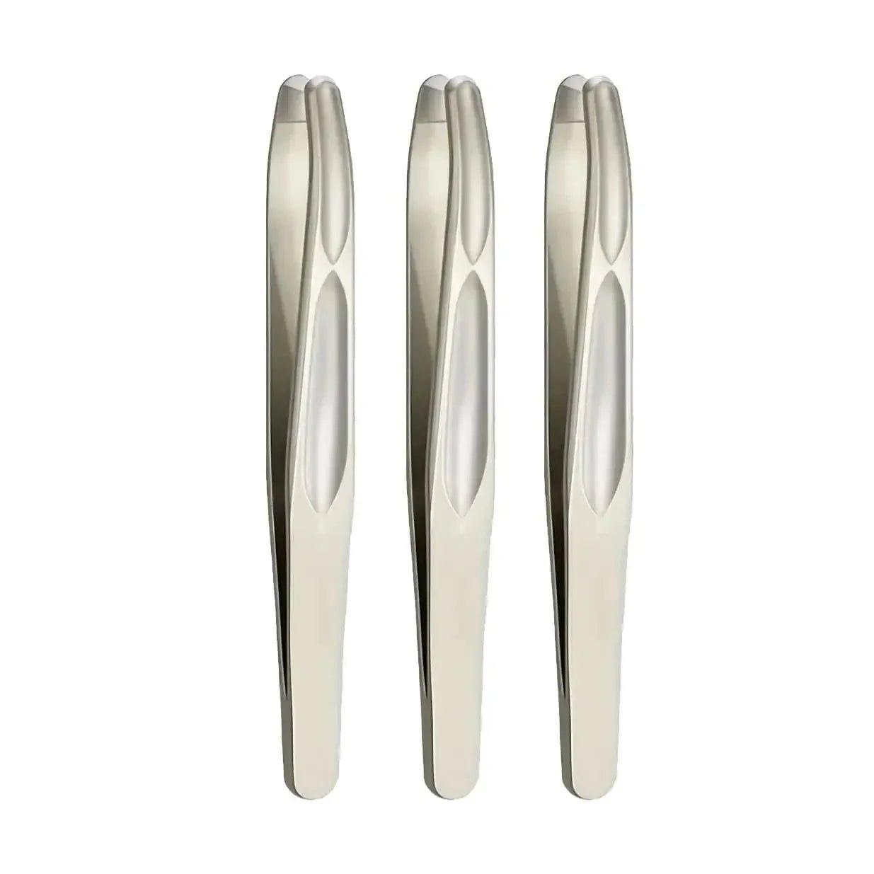 Three sleek stainless steel tweezers for precise beauty grooming and fashion skincare routines