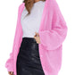 Pink waffle knit cardigan with balloon sleeves, paired with white tee and black leather mini skirt