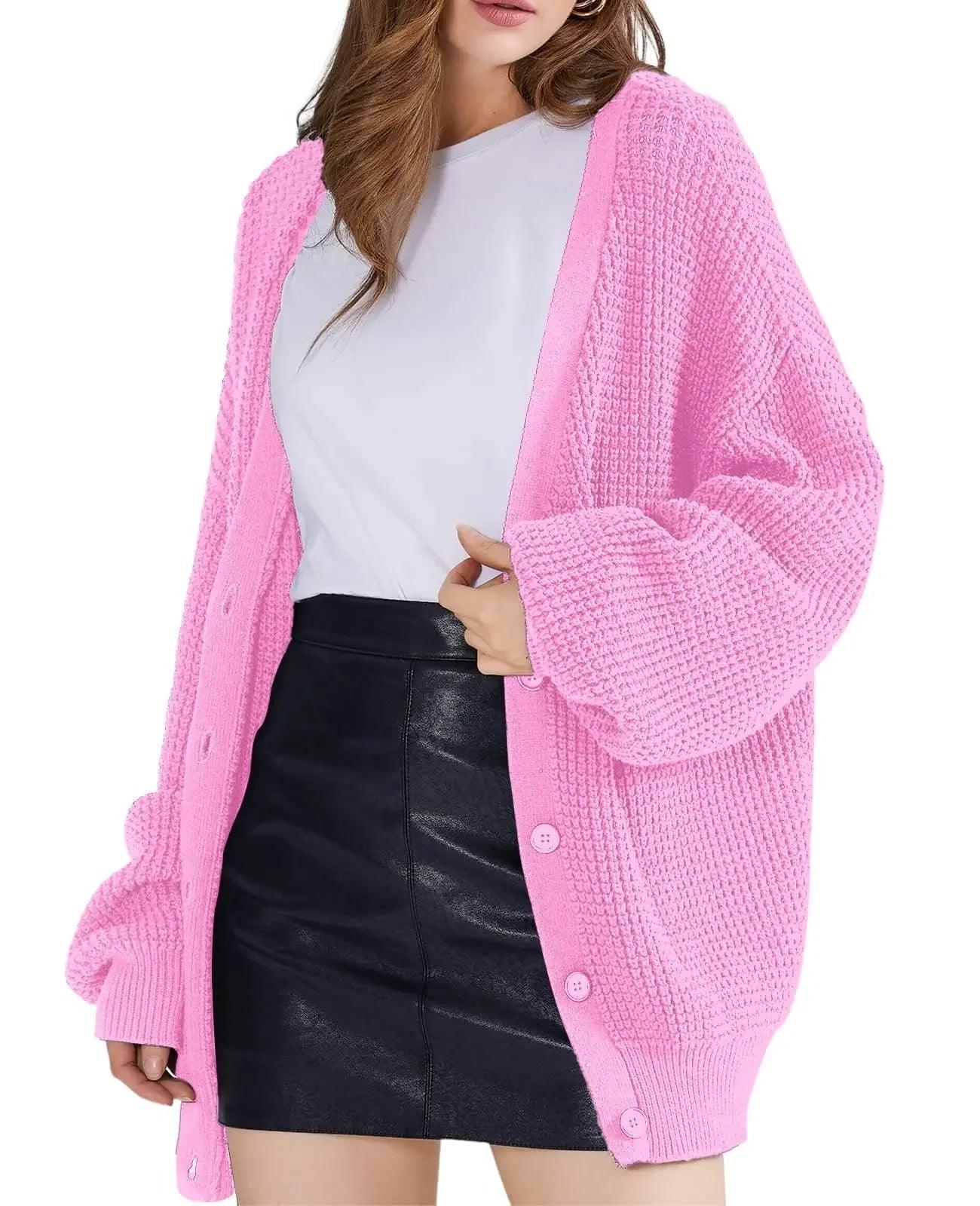 Pink waffle knit cardigan with buttons, styled over white tee and black leather mini skirt for women's fashion