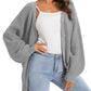 Gray waffle knit cardigan with buttons, styled over white camisole and light wash jeans for women's fashion