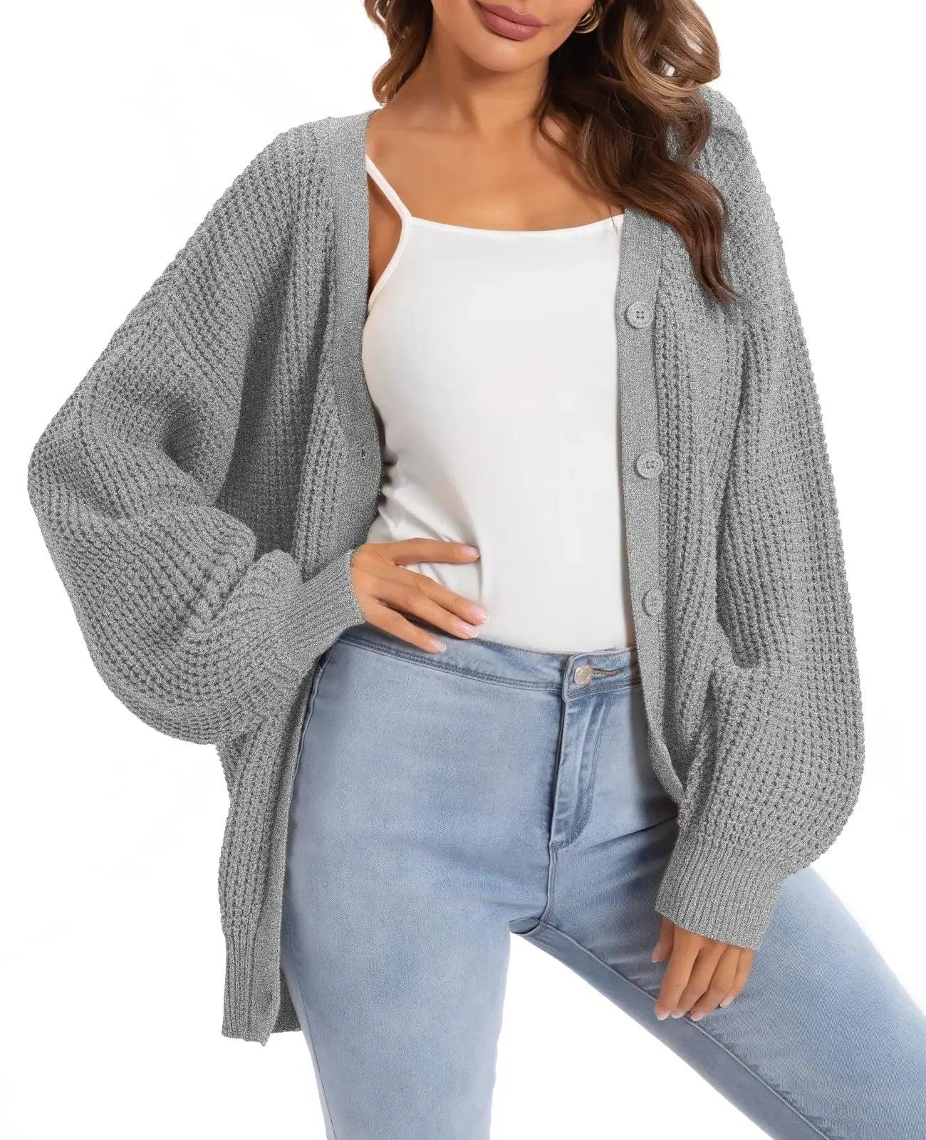 Gray waffle knit cardigan with buttons, styled over white camisole and light wash jeans for women's fashion