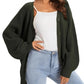 Olive green waffle knit cardigan with buttons, styled over white cami and light wash jeans for women's fashion
