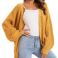 Mustard yellow knitted cardigan with buttons, styled over white top and jeans for women's fashion