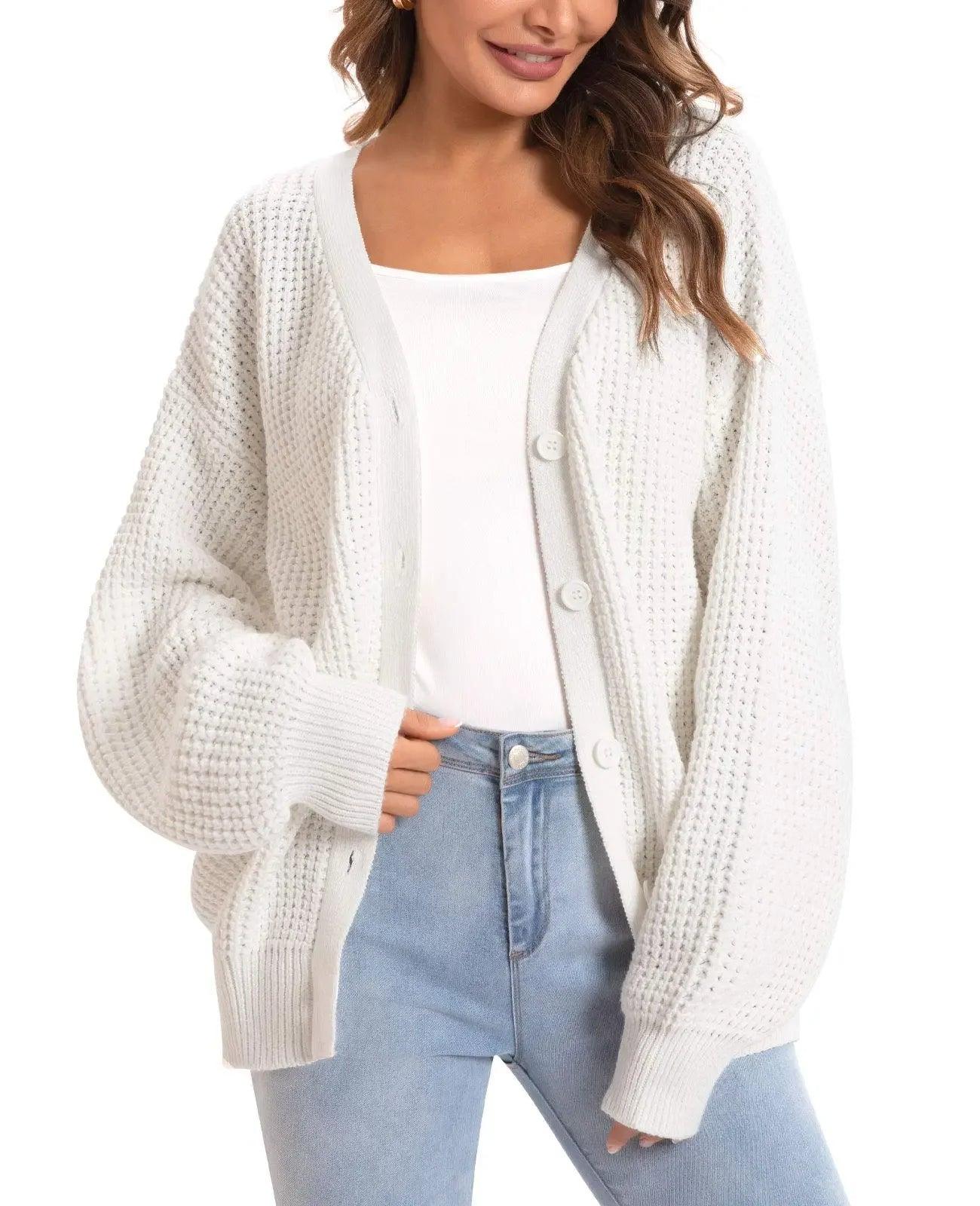 White waffle knit cardigan sweater for women, cozy button-up style with balloon sleeves, paired with jeans