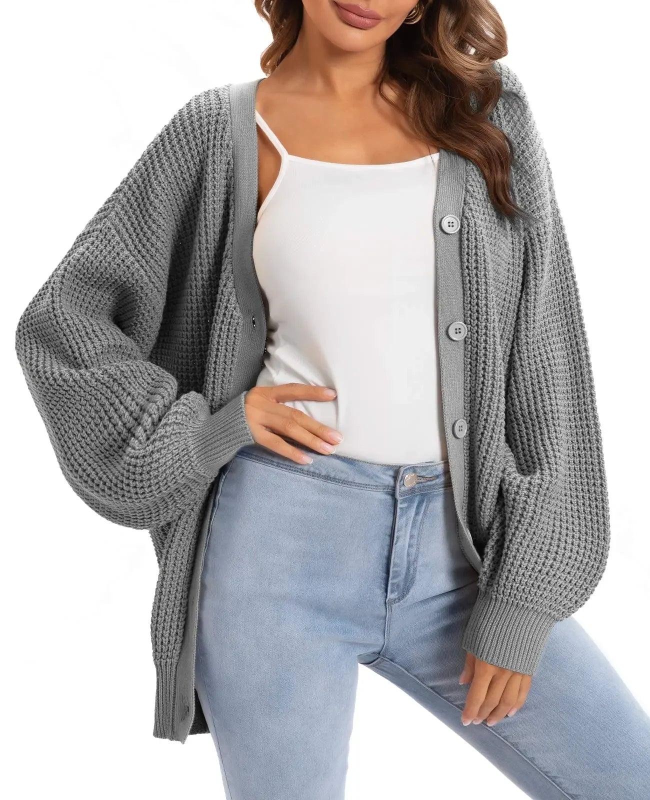 Gray knit cardigan with buttons, styled over white top and light wash jeans for women's fashion