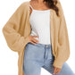 Beige waffle knit cardigan with buttons, styled over white top and light wash jeans for women's fashion