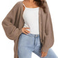 Women's cozy knit cardigan with buttons, styled with white top and light wash jeans for casual fashion